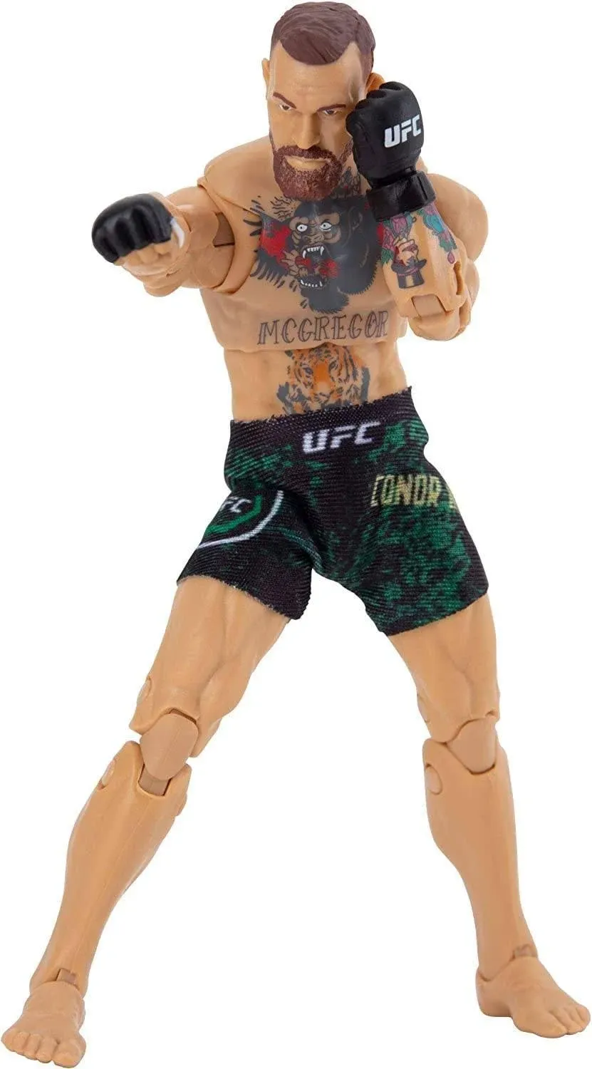 UFC Ultimate Series Limited Edition Daniel Cormier, 6 Inch Collector Action Figure - Includes Alternate Head and Gloved Hands, Fight Shorts, Belt and American Flag Accessory